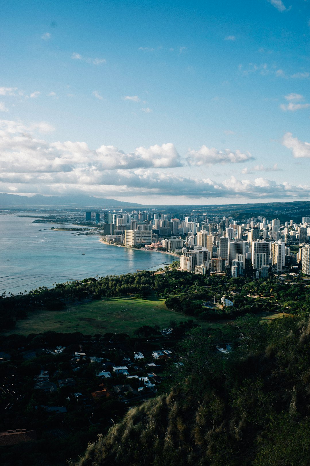 city-skyline-near-body-of-water-under-blue-and-white-sunny-cloudy-sky-during-daytime-0lpirqyew5c