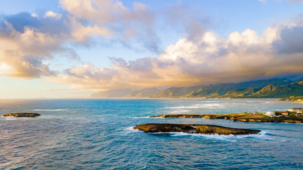 modern-yacht-sailing-on-the-ocean-near-land-g6tct9kxzhi