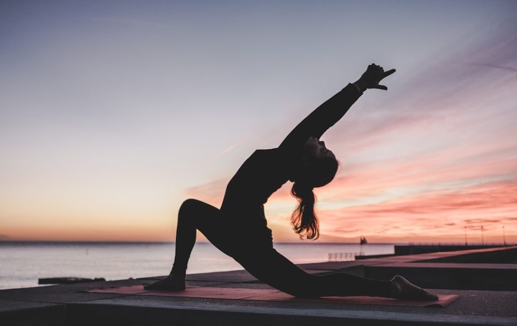 silhouette-photography-of-woman-doing-yoga-f2qh3yjz6jk